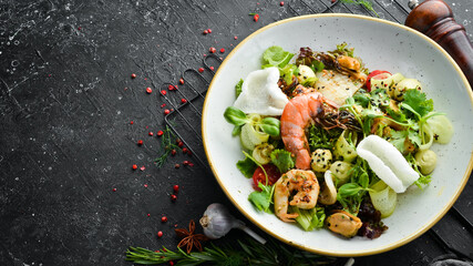 Seafood salad: mussels, shrimp, squid. Top view. Free space for text.