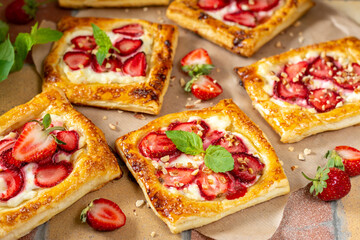 Puffs with cheese cream and strawberries. Delicious homemade sweet pastries