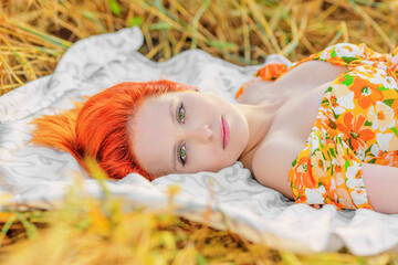 Beautiful young woman in field
