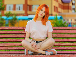 Beautiful young woman on bench