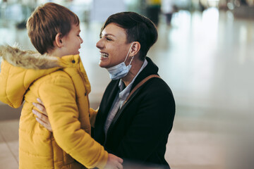 Woman meeting her son at airport