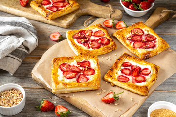 Puffs with cheese cream and strawberries. Delicious homemade sweet pastries
