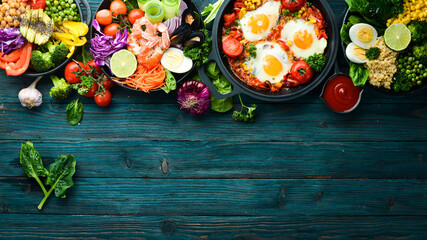 Fototapeta premium Food. Set of dishes on the table. Traditional cuisines of the world. Top view. Free space for your text.