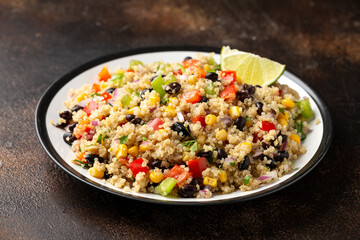 Quinoa black bean salad with corn, red green pepper, onion. Healthy food.