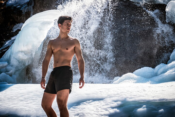Shirtless Young Athletic Man Outdoor in Country Standing on Snow.