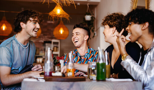 Laughing friends in a restaurant