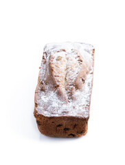Homemade freshly baked cake loaf with raisins isolated on white