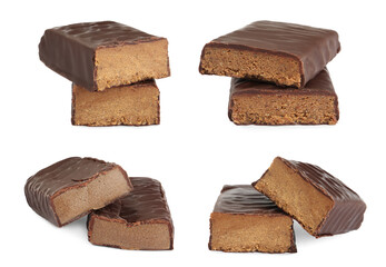 Set with delicious protein bars on white background