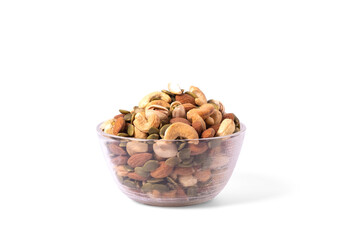 many snack nuts pumpkin seeds, pistachios, macadamia nuts, cashew nut, almond in glass bowl on white background. Vegetarian or vegan snake. Healthy food eating.