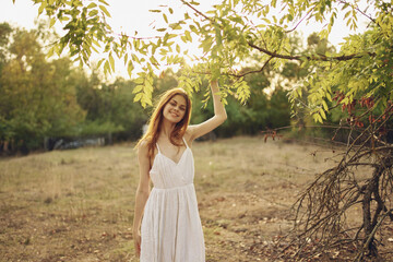 pretty woman in white dress summer walk trees vacation