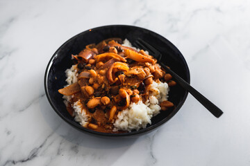 vegan chana masala sauce with chickpeas onion and with white rice, healthy plant-based food