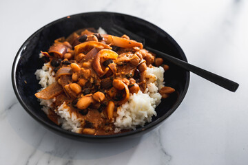 vegan chana masala sauce with chickpeas onion and with white rice, healthy plant-based food