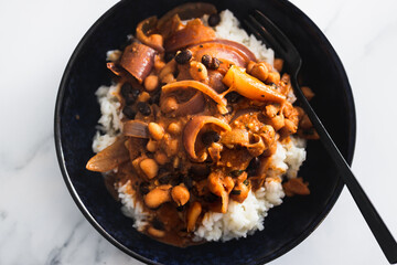 vegan chana masala sauce with chickpeas onion and with white rice, healthy plant-based food