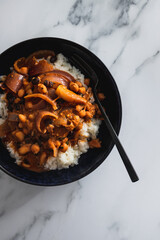 vegan chana masala sauce with chickpeas onion and with white rice, healthy plant-based food