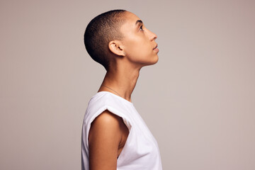 Androgynous woman with shaved head - Powered by Adobe