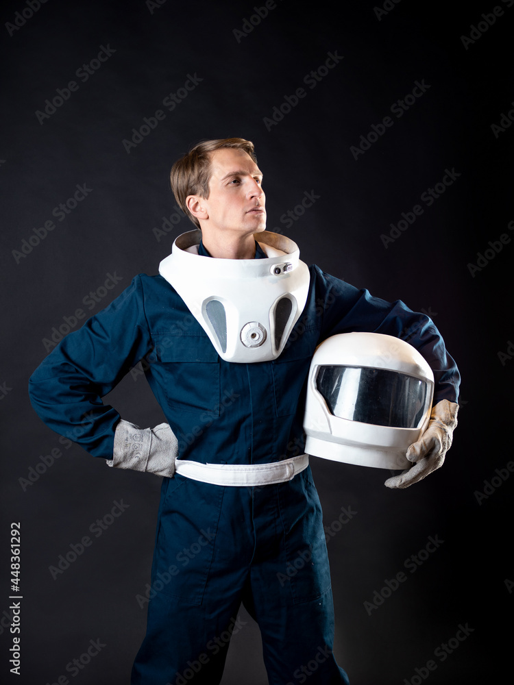 Wall mural an astronaut in a spacesuit is ready for launch.