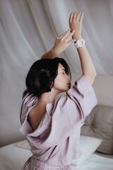 Fototapeta premium Gorgeous beautiful girl is in elegant pajamas is in bed. Natural female beauty.