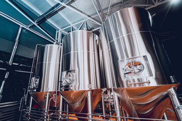 Rows of steel tanks for beer fermentation and maturation in a craft brewery