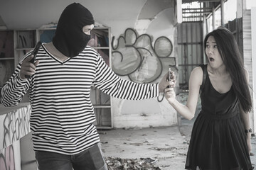 Thief running for stealing mobile from young woman.