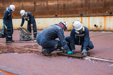 Male worker inspection vacuum test weld tank