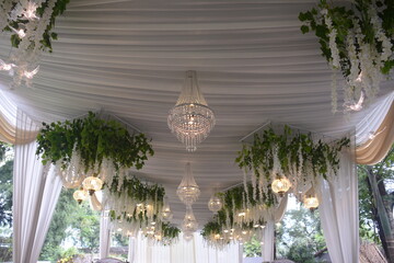 beautiful chandelier interior. Expensive luxury chandeliers hang under the ceiling in the palace. Crystal chandelier: east java, indonesia -25 Dec 2020