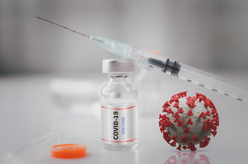 Syringe with liquid vaccines on table in laboratory,Concept covid-19 corona virus.