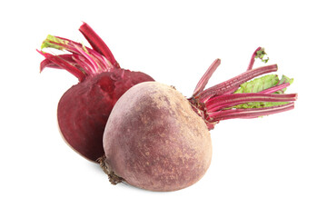 Whole and cut ripe beetroots on white background