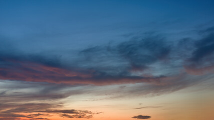 Naklejka na ściany i meble Summer evening sky just after sunset. Long exposure, shallow depth of field. 