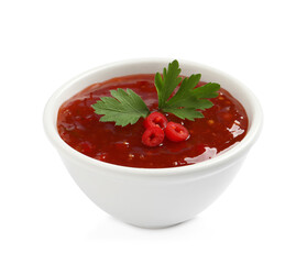 Spicy chili sauce with parsley on white background