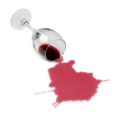 Overturned glass and spilled wine on white background