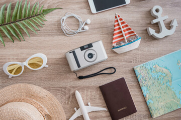 top view travel concept with camera films, smartphone and Outfit of traveler