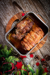 Baked bacon roulade and roasted pork neck.