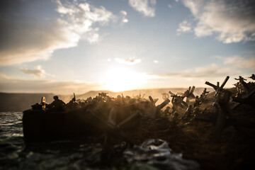 World War 2 reenactment (D-day). Creative decoration with toy soldiers, landing crafts and hedgehogs. Battle scene of Normandy landing on June 6, 1944.