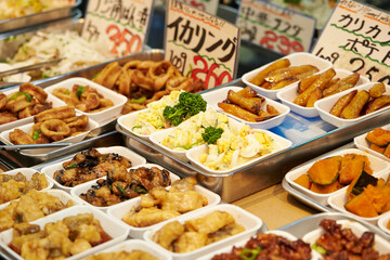 Side dishes displayed in a traditional Japanese market 