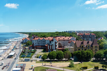 The coast of the city of Zelenogradsk with a view of the embankment, houses and pier, top view.