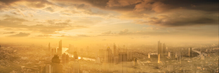 Cityscape Bangkok skyline with sunset and mist. City is full of pollution, dust, PM 2.5 fumes, and carbon dioxide. spread of the virus in the air destroys the economy.