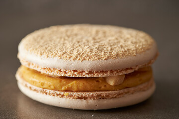 Creamy macarons on a gray background 