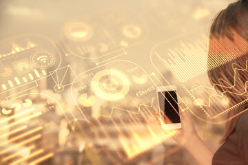 Double exposure of tech icon hologram and woman holding and using a mobile device. Technology...