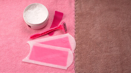 Set of different means for epilation on a colored background. Removal of unwanted hair. Modern epilator, wax strips, razor.