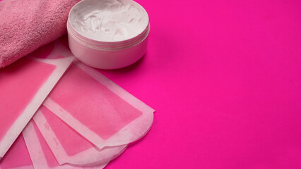 Set of different means for epilation on a colored background. Removal of unwanted hair. Modern epilator, wax strips, razor.