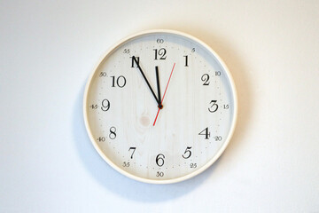 Clock or watch on a white wall,  Clock with a red sweep hand, Wood clock, Wooden watch