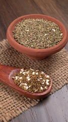 Ajwain Also Know as Ajowan, Caraway or (Trachyspermum Ammi) in spoon and in bowl.