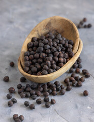 Wooden bowl of black chickpea closeup