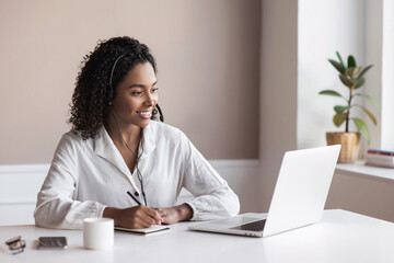 Distance studying, e-learning concept. Woman using laptop computer at home, study online. Student girl working in her room. Work or studying from home, business, creative occupation, meeting online