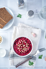 Beetroot salad with pine nuts in a bowl