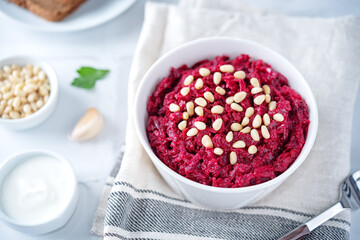 Beetroot salad with pine nuts in a bowl