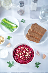 Beetroot salad with pine nuts in a bowl