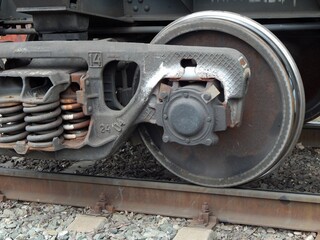 Cargo train wheels close-up. Wheeled trolley of a freight train.  - 448389665