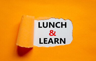 Lunch and learn symbol. Words 'Lunch and learn' appearing behind torn orange paper. Beautiful...