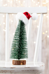 Obraz premium Christmas tree on bohek wooden, bokeh background.